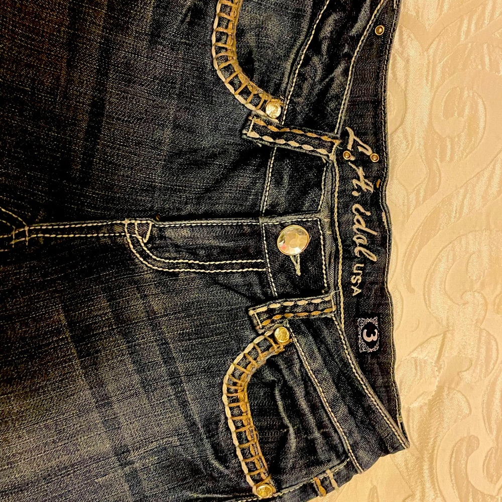 Excellent condition, Used like new. White stitching rhinestones